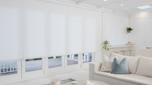 Whisper Shades, known for their insulating properties, installed in open living space