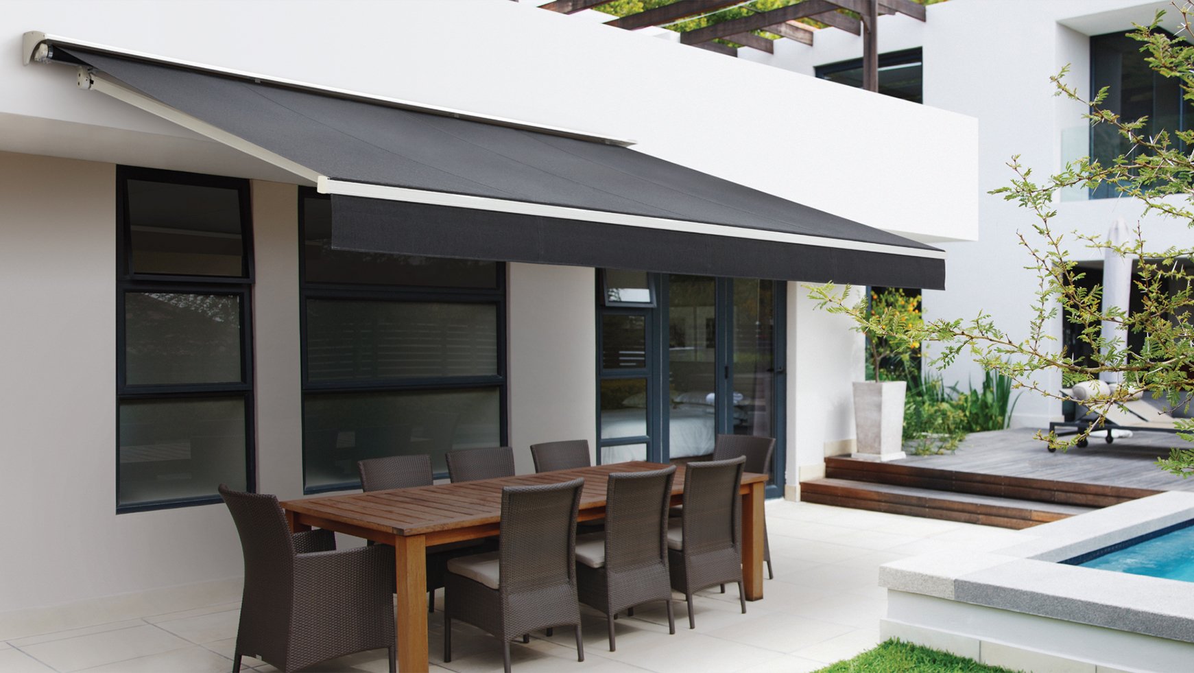 Kona Awnings covering an outdoor dining setting